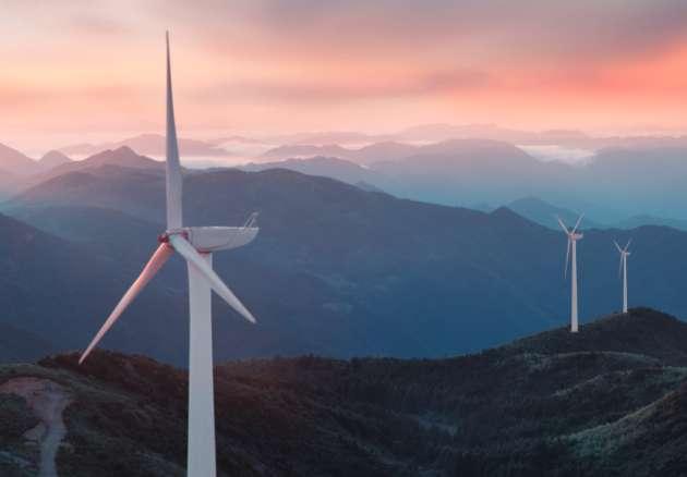 Windmill on a mountain at dawn